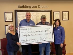 Terry Lind and Becky Turnquist of Tusen Tack recently accepted the check from Federated Co-ops. In the picture with Terry and Becky is Raquel Paulson (CFO) and Mike McMahon.(CEO) of Federated Co-ops